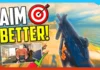 First-person view holding a gun in a video game, with "Aim Better!" text and target graphics, offering tips to help you improve your aim in FPS games.